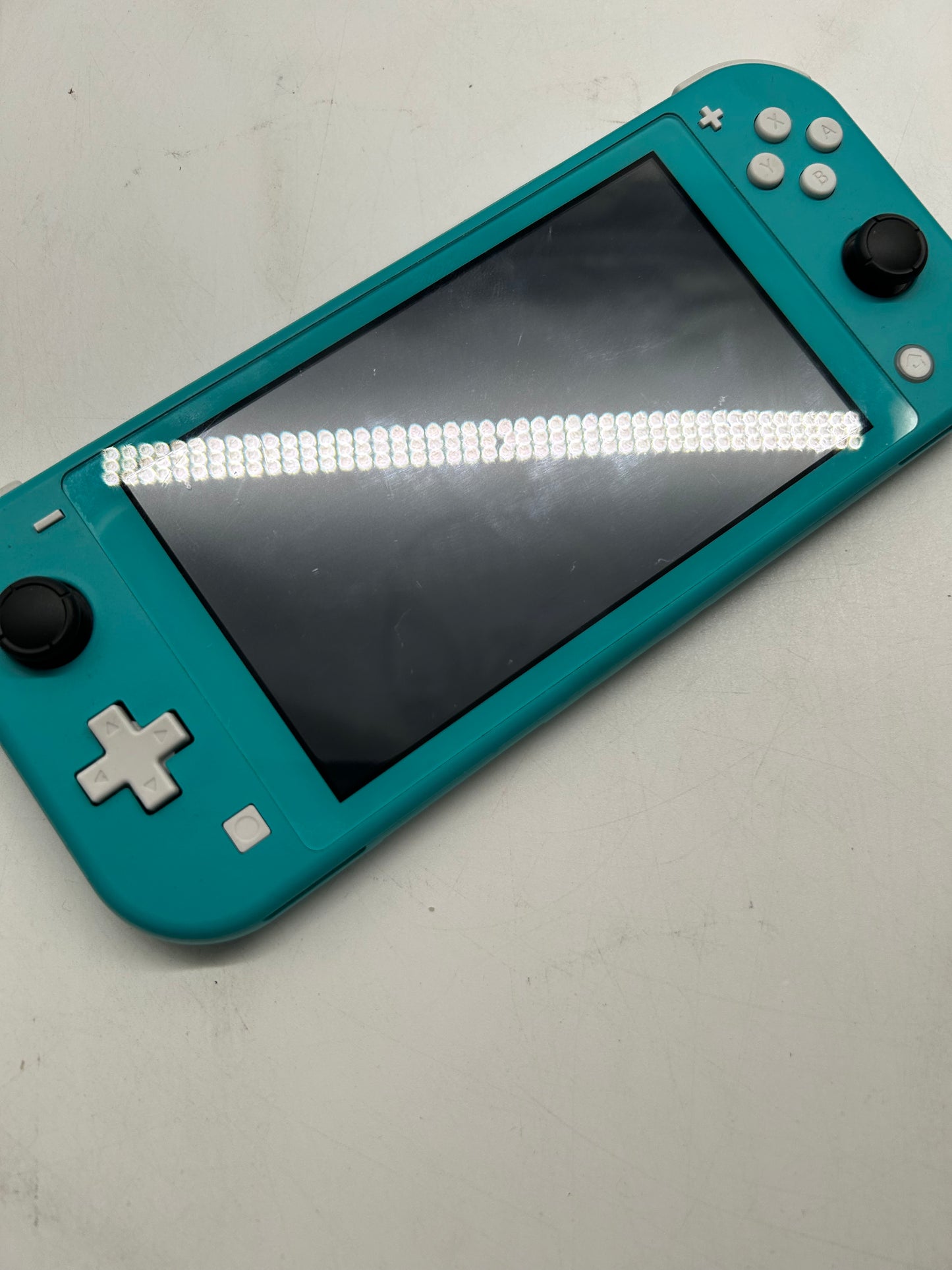 Nintendo Switch Lite Türkis mit Spiel und Tasche