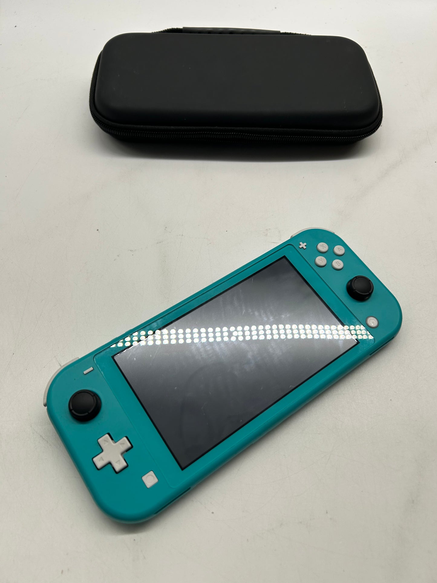 Nintendo Switch Lite Türkis mit Spiel und Tasche