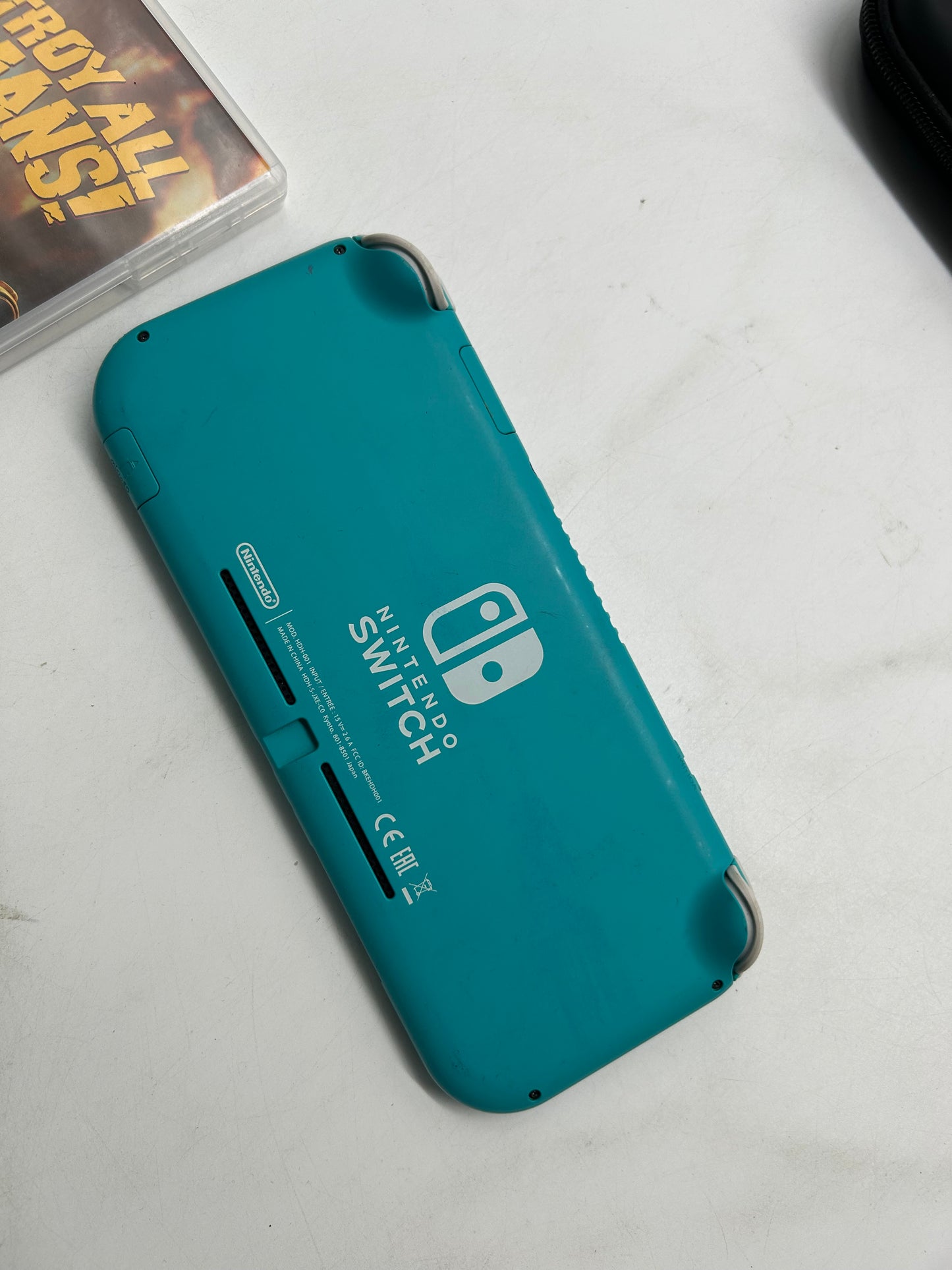 Nintendo Switch Lite Türkis mit Spiel und Tasche