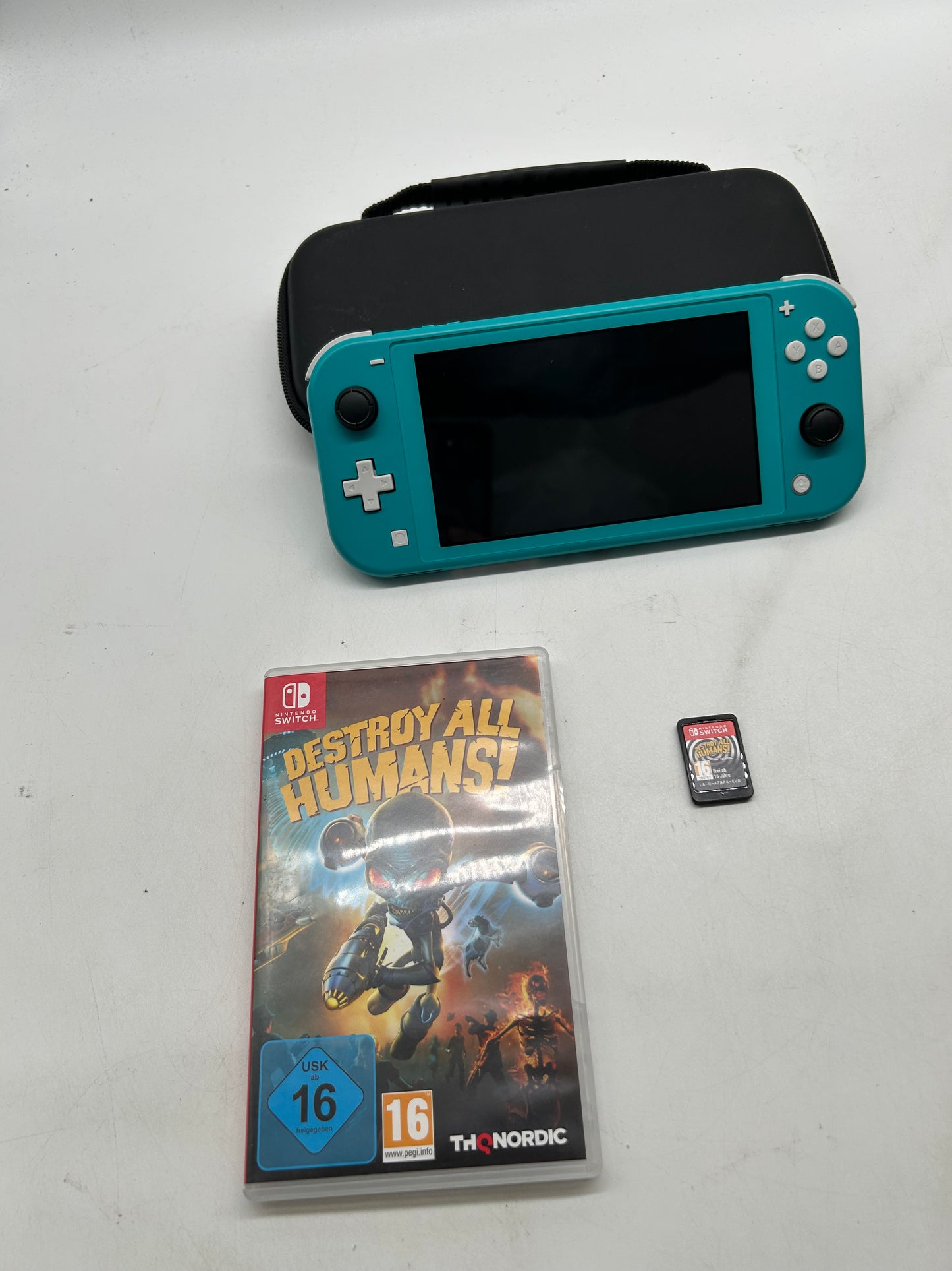 Nintendo Switch Lite Türkis mit Spiel und Tasche