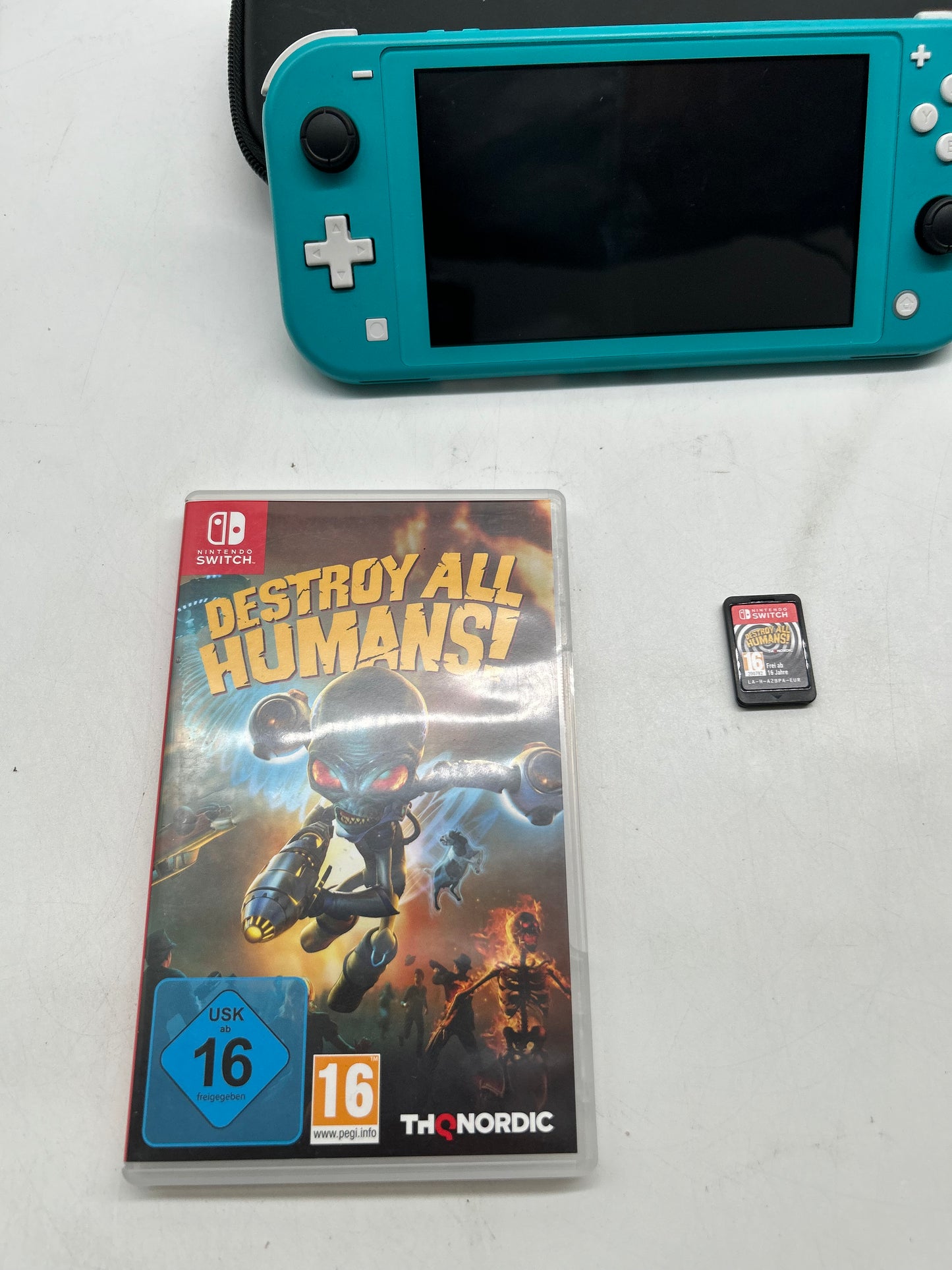 Nintendo Switch Lite Türkis mit Spiel und Tasche