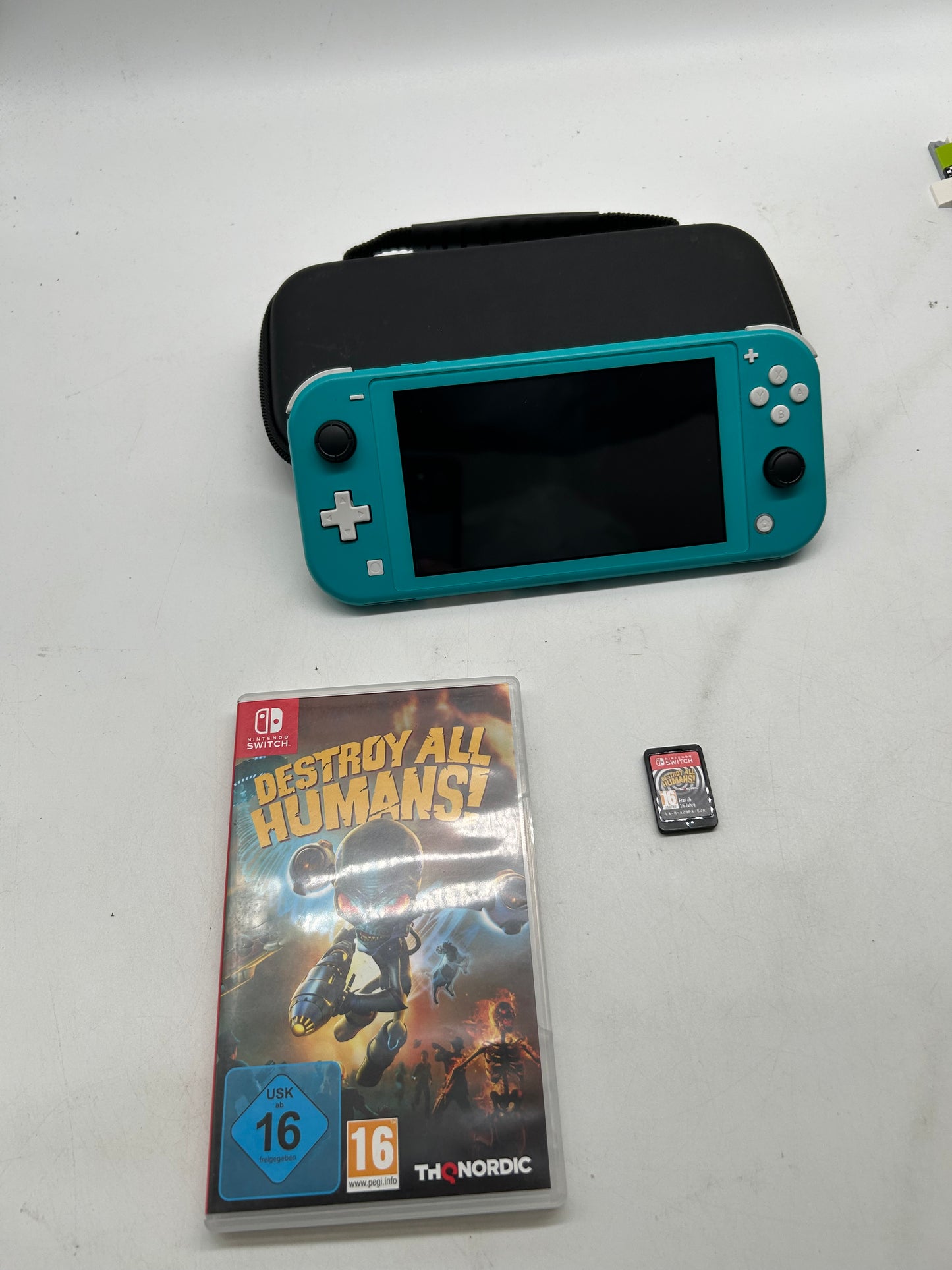 Nintendo Switch Lite Türkis mit Spiel und Tasche