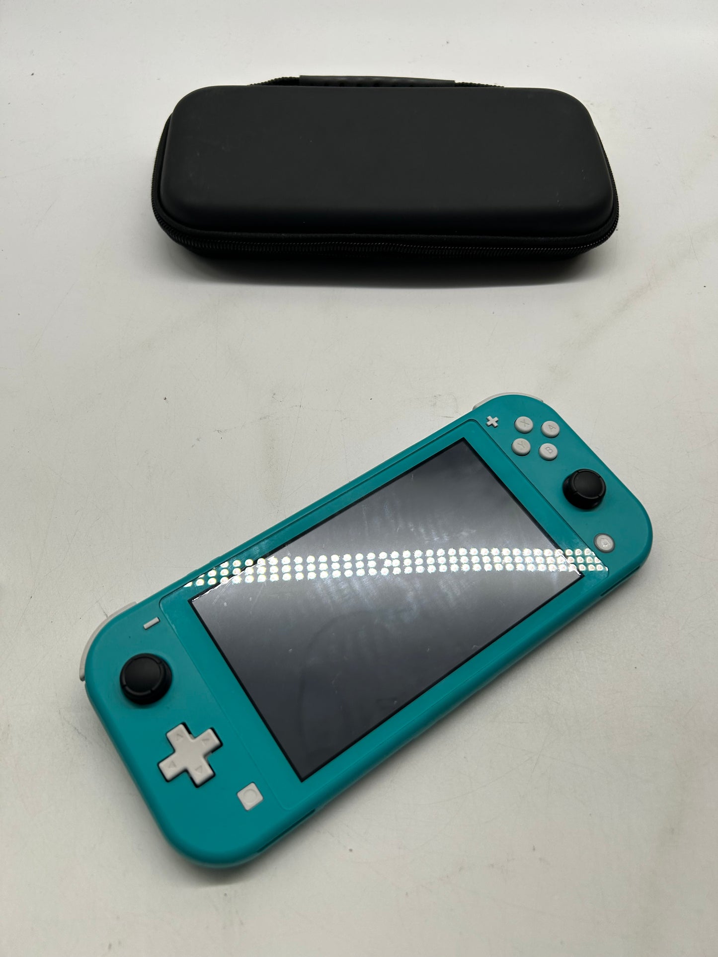 Nintendo Switch Lite Türkis mit Spiel und Tasche